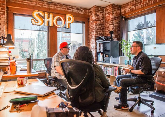 Shop team having a studio meeting.