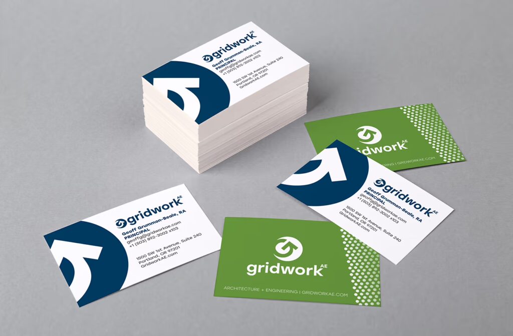Gridwork AE business cards on a gray background